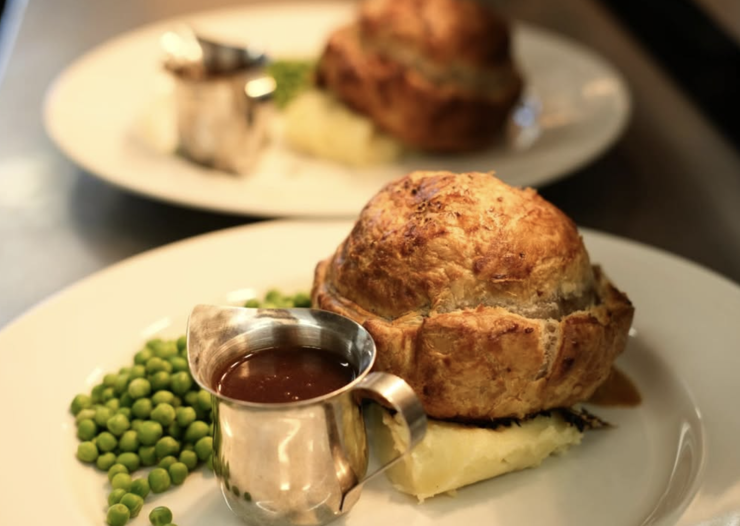 Hand-raised pub pie with mash, peas and rich gravy